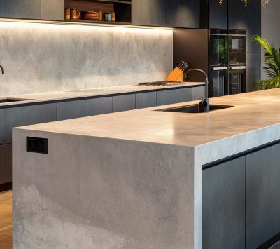 A Kitchen With a Large Island and a Sink — Stone Effects In Forest Glen, QLD