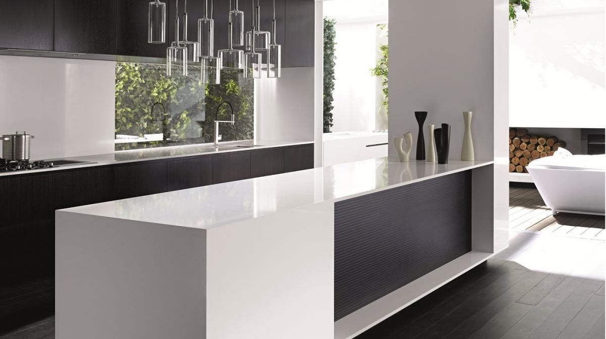 A Kitchen With a Large White Island and Black Cabinets — Stone Effects In Forest Glen, QLD