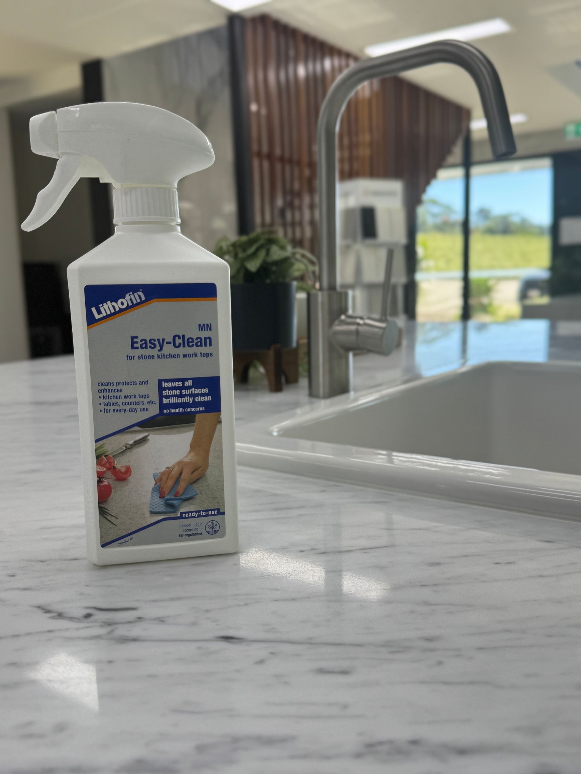 A Kitchen With a Large Island and a Sink — Stone Effects In Forest Glen, QLD
