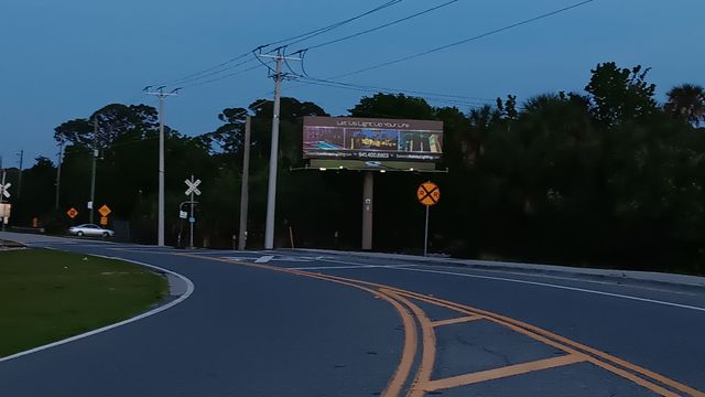 A black and white photo of a koworx billboard