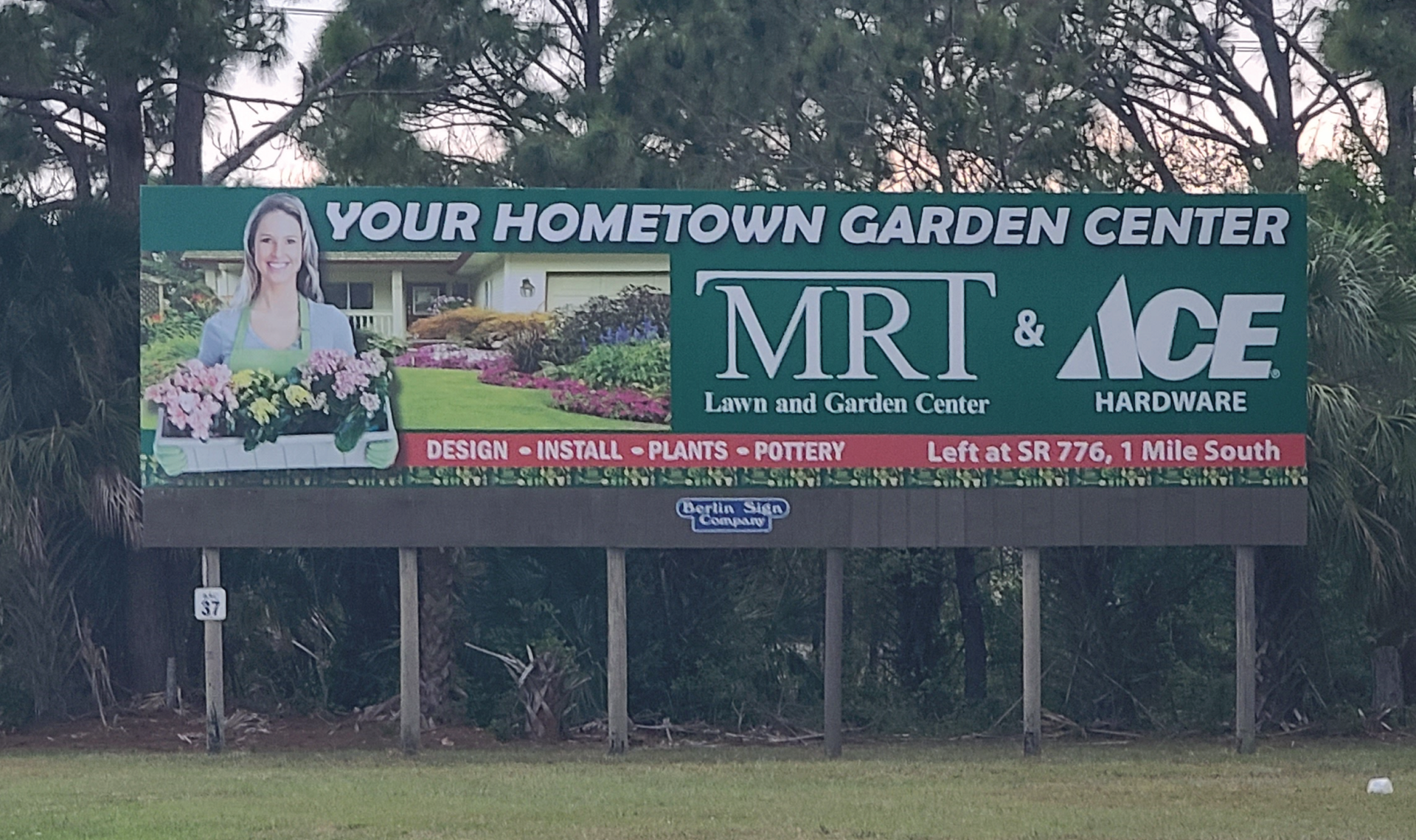 A large billboard for mrt and ace hardware