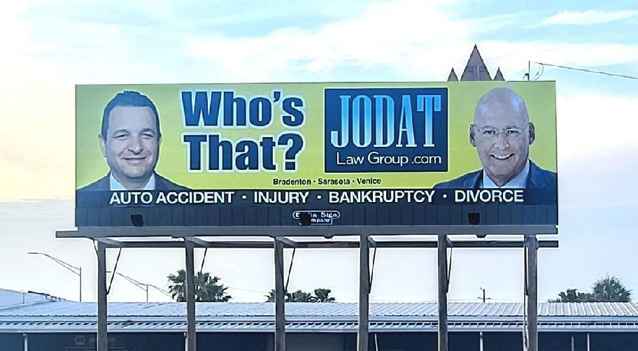 A billboard that says who 's jodat on it