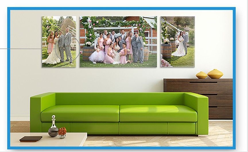 A staircase with a lot of pictures on the wall above it.