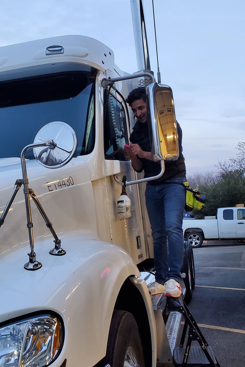 Installing Tint to Truck's Window — Woodbridge, VA — First Class Tint & Vinyl