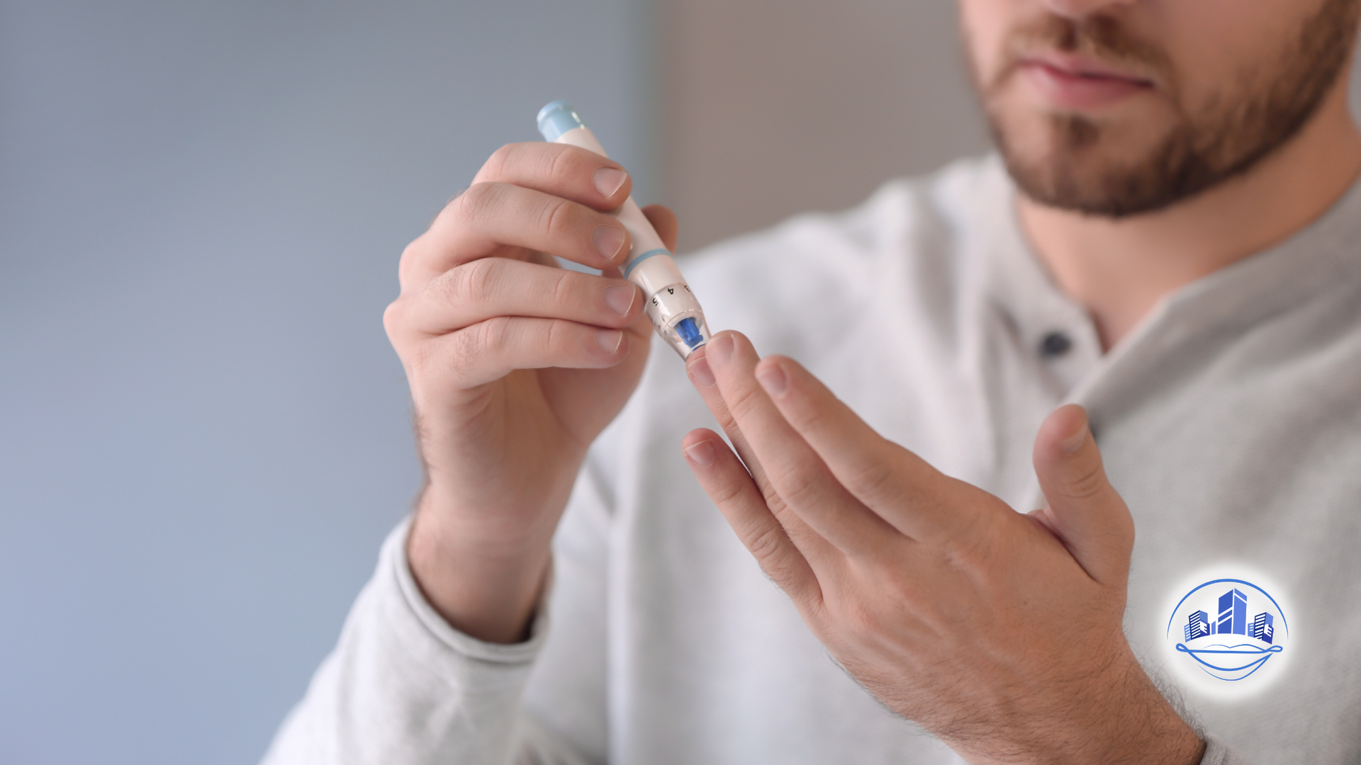 Person using a lancet to prick their finger, presumably for a blood glucose test.