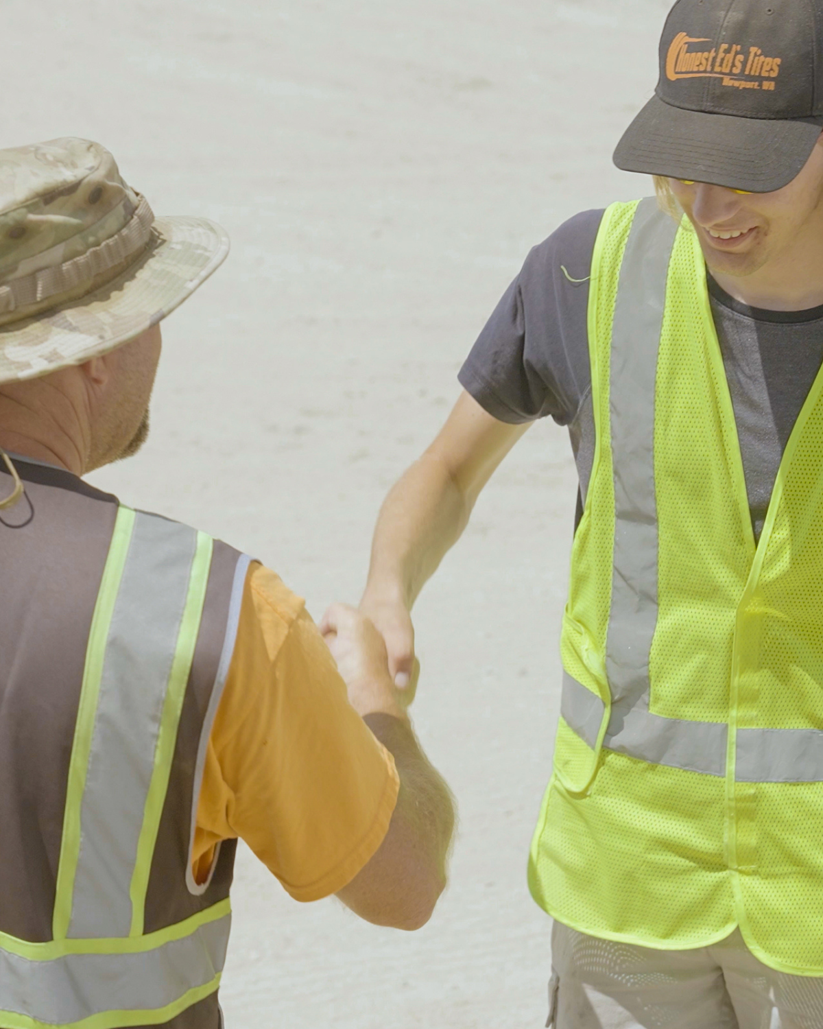 A student shaking a CDL instructors hand smiling getting ready for training on the CDL yard