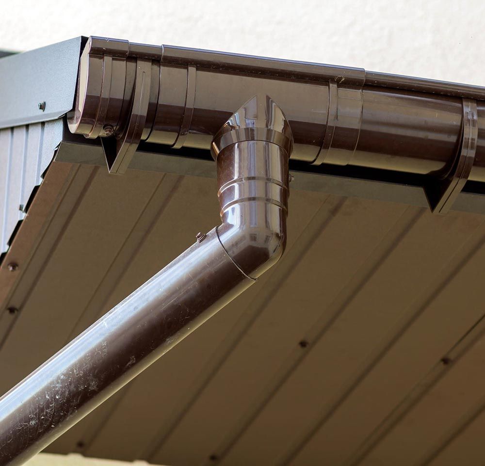a close up of a brown gutter on a roof