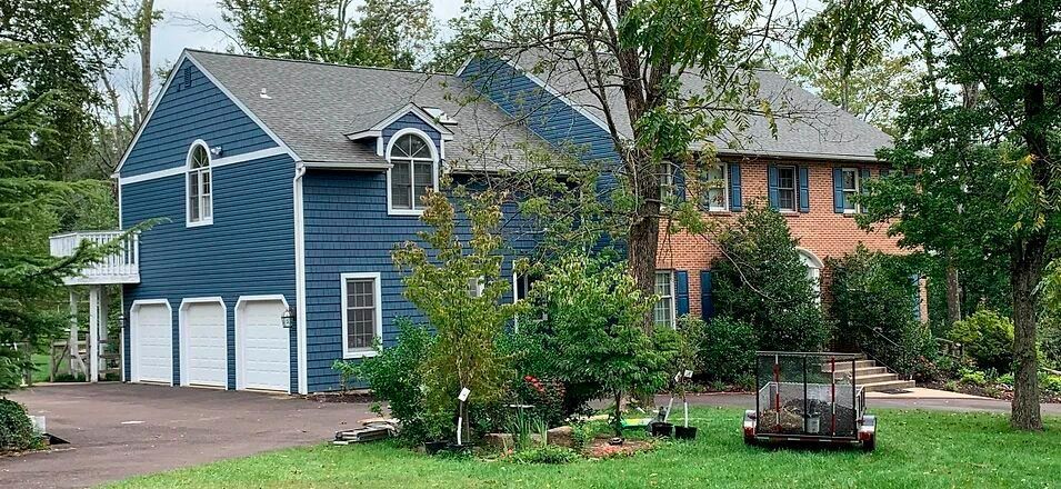 a blue house and a red house are next to each other