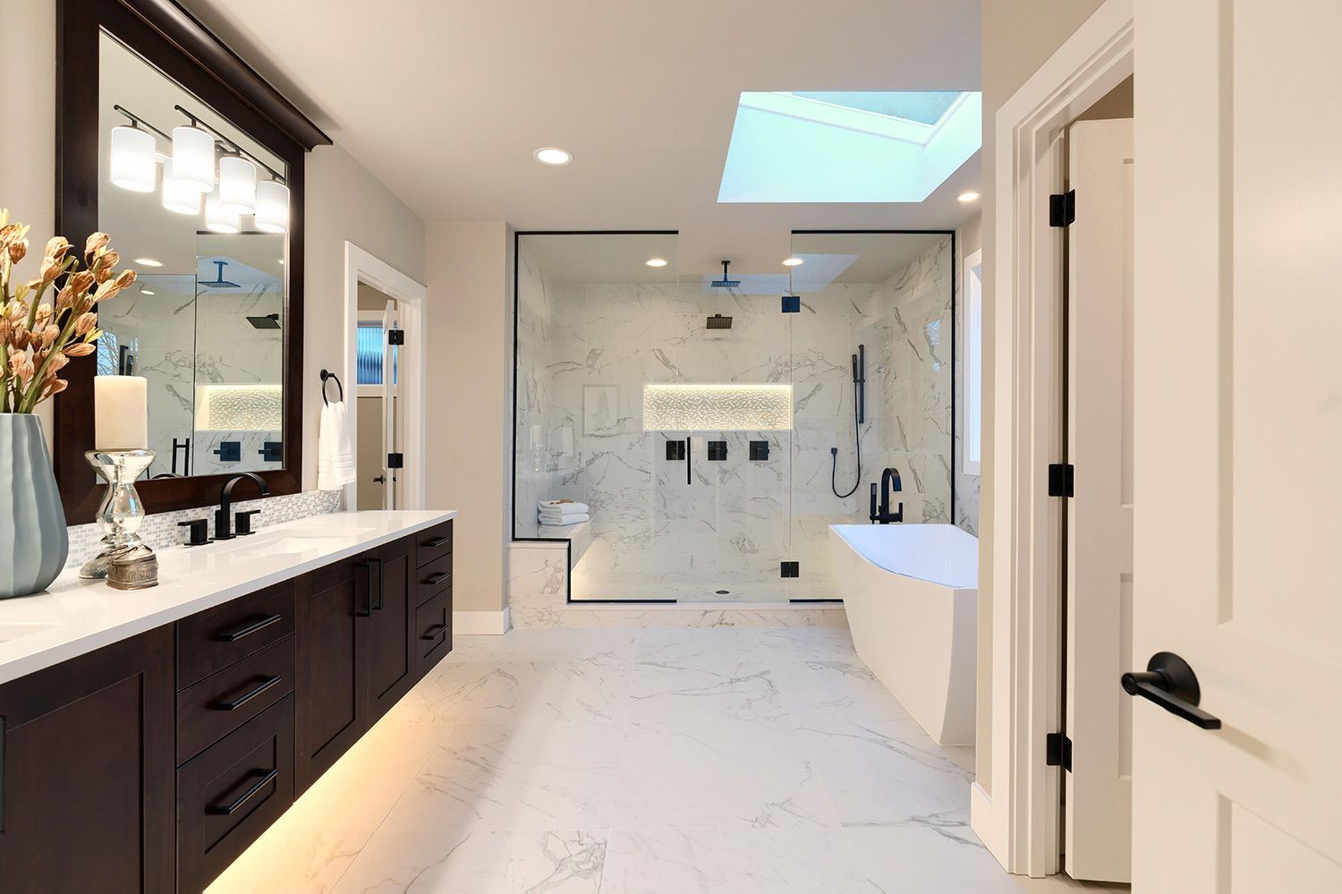 Spacious bathroom with glass shower door