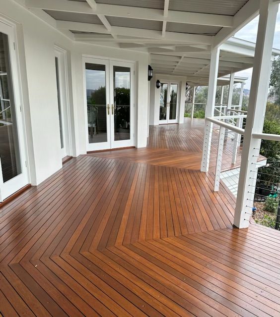 A Large Porch With a Wooden Floor and White Walls — Skyline Painting In Lavington, NSW