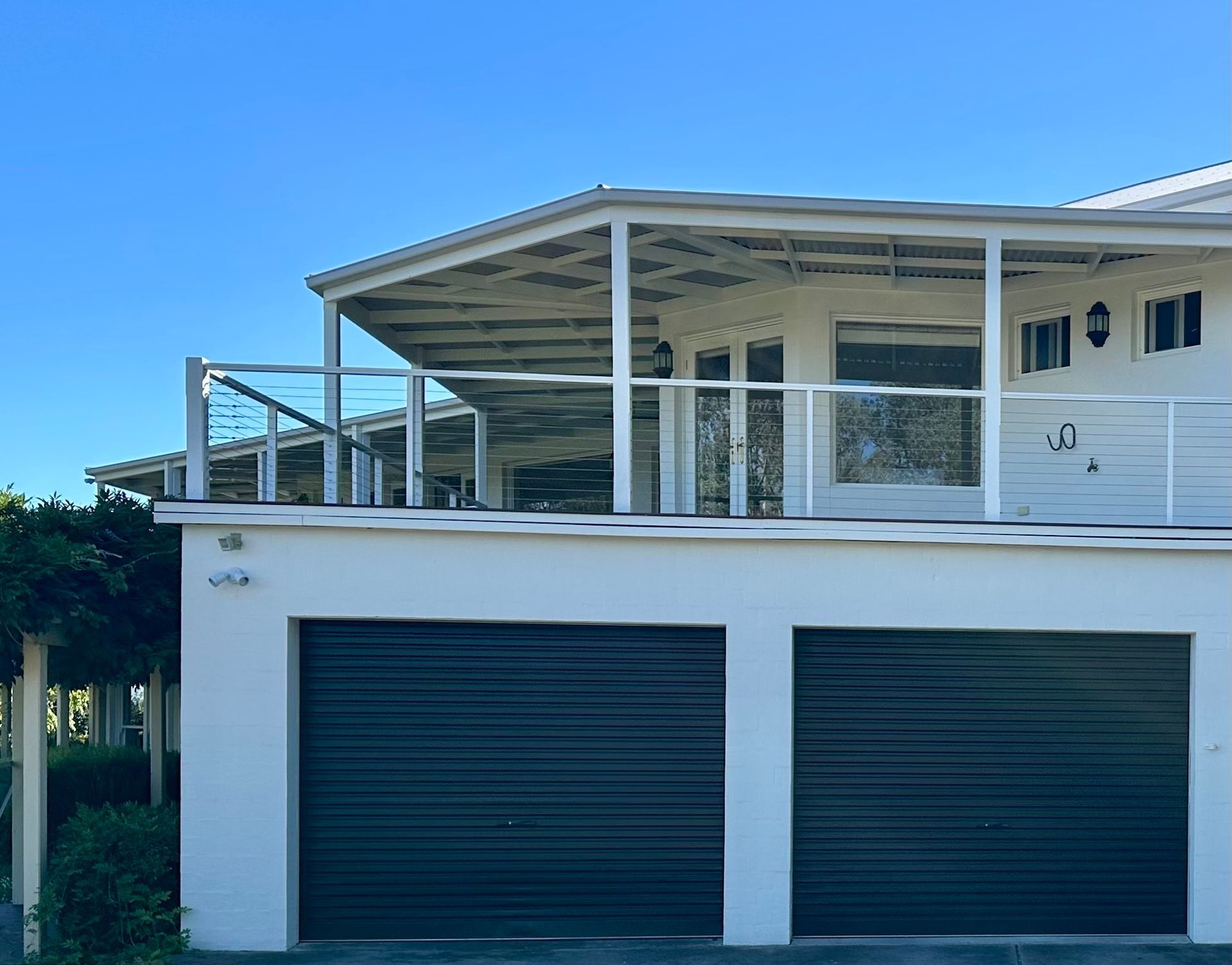 A White House With Two Garage Doors and a Balcony — Skyline Painting In Lavington, NSW