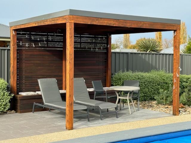 A Pergola With Chairs and a Table Next to a Pool — Skyline Painting In Lavington, NSW