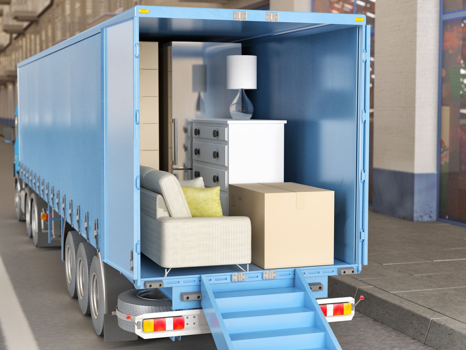 Blue moving truck with ramp loaded with furniture and boxes.