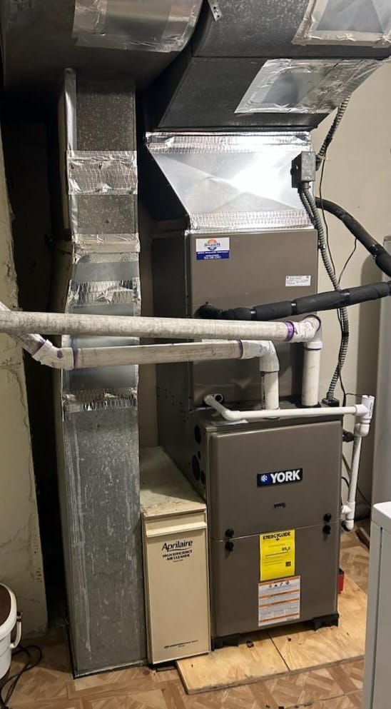 A york heating and cooling system is installed in a basement.