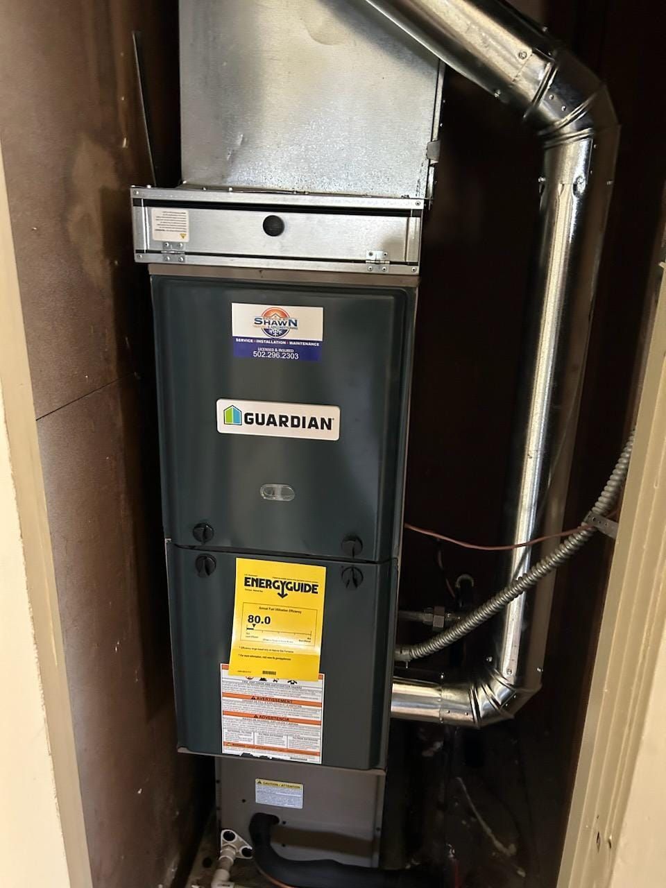 An air conditioner is installed in a corner of a room.