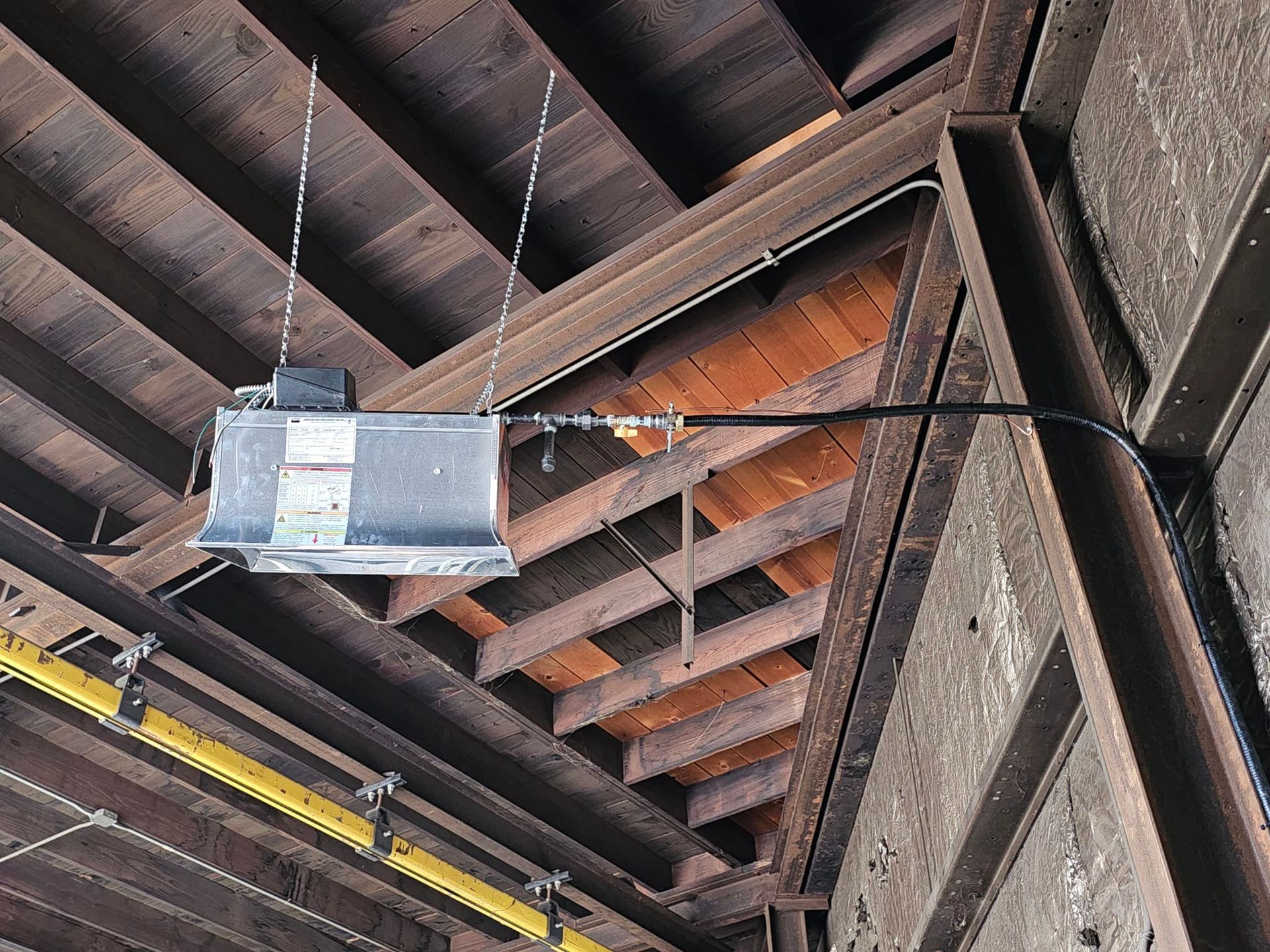 A light is hanging from the ceiling of a building