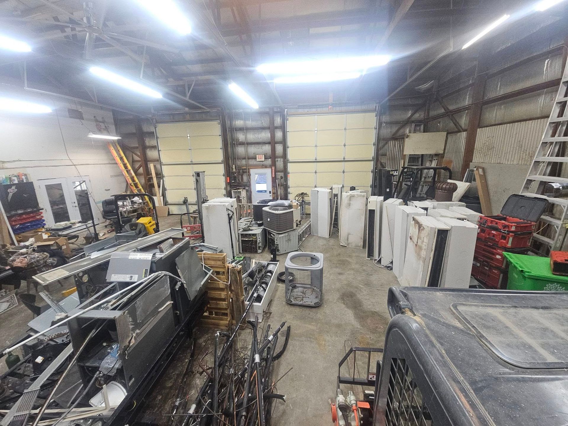 A large warehouse filled with lots of appliances and equipment.