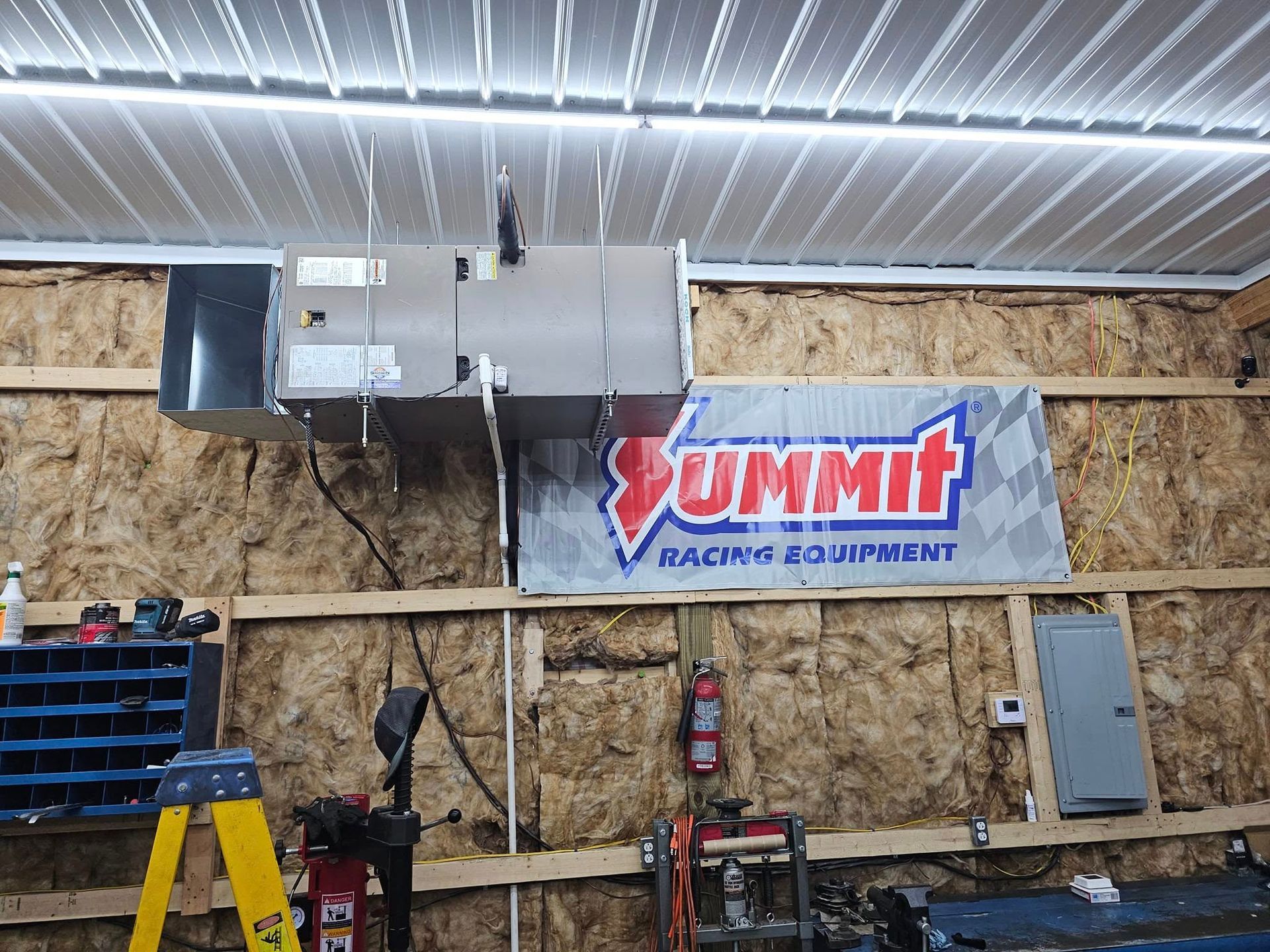 A garage with a sign that says summit racing equipment