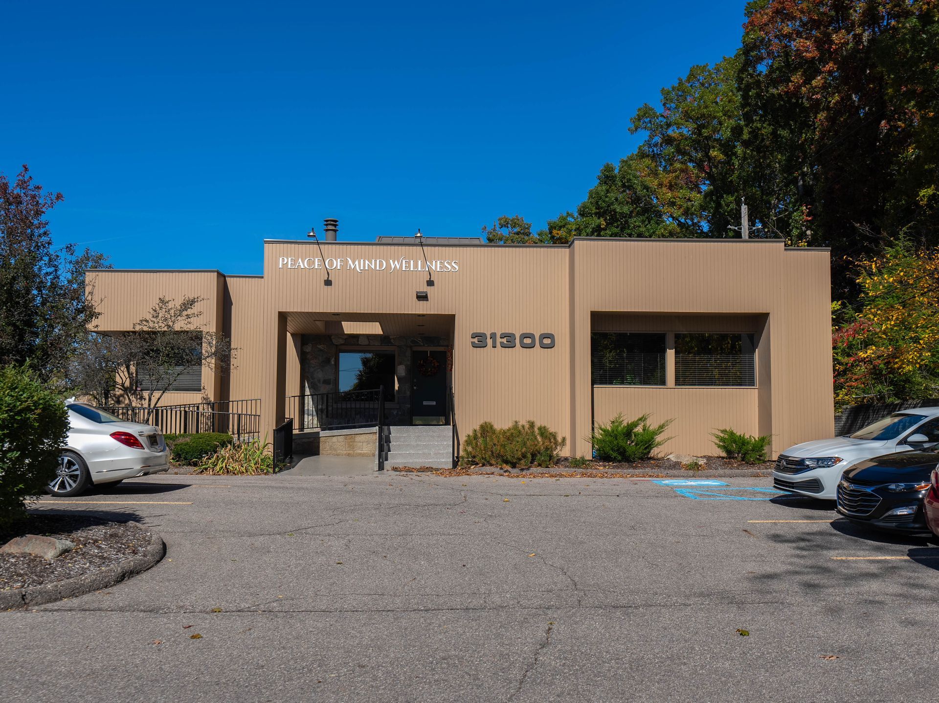 Tan one-story building with the address