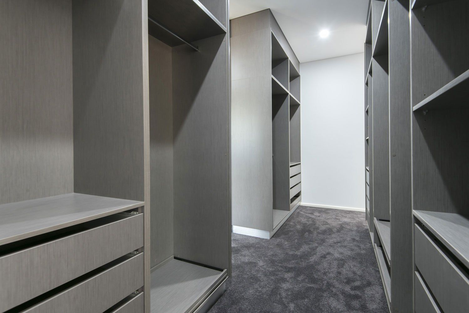 A Walk in Closet With Lots of Shelves and Drawers — Top End Joinery In Yarrawonga, NT
