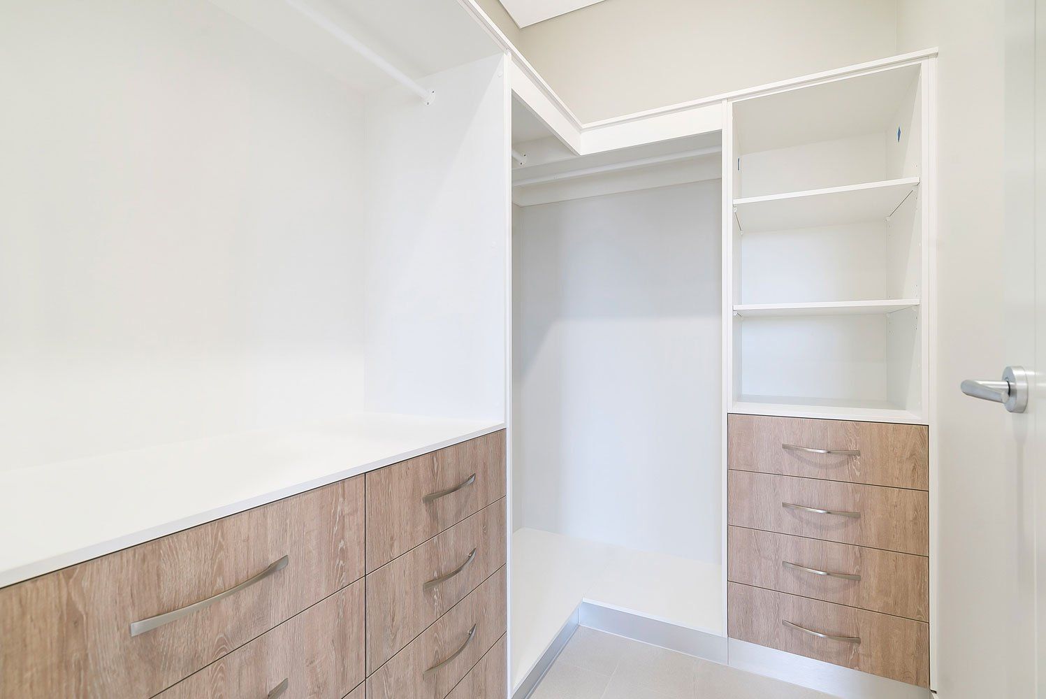 A Walk in Closet With Wooden Drawers and Shelves — Top End Joinery In Yarrawonga, NT