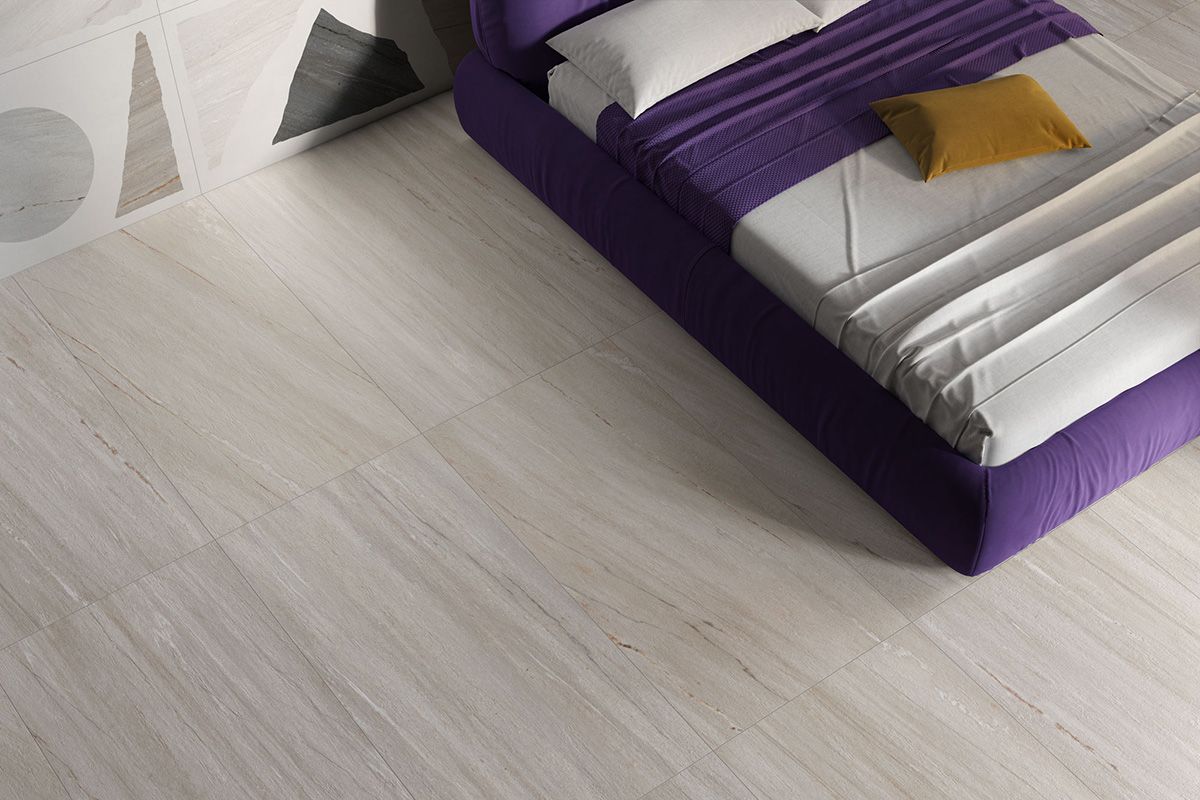 Una camera da letto con un letto viola e un pavimento bianco.