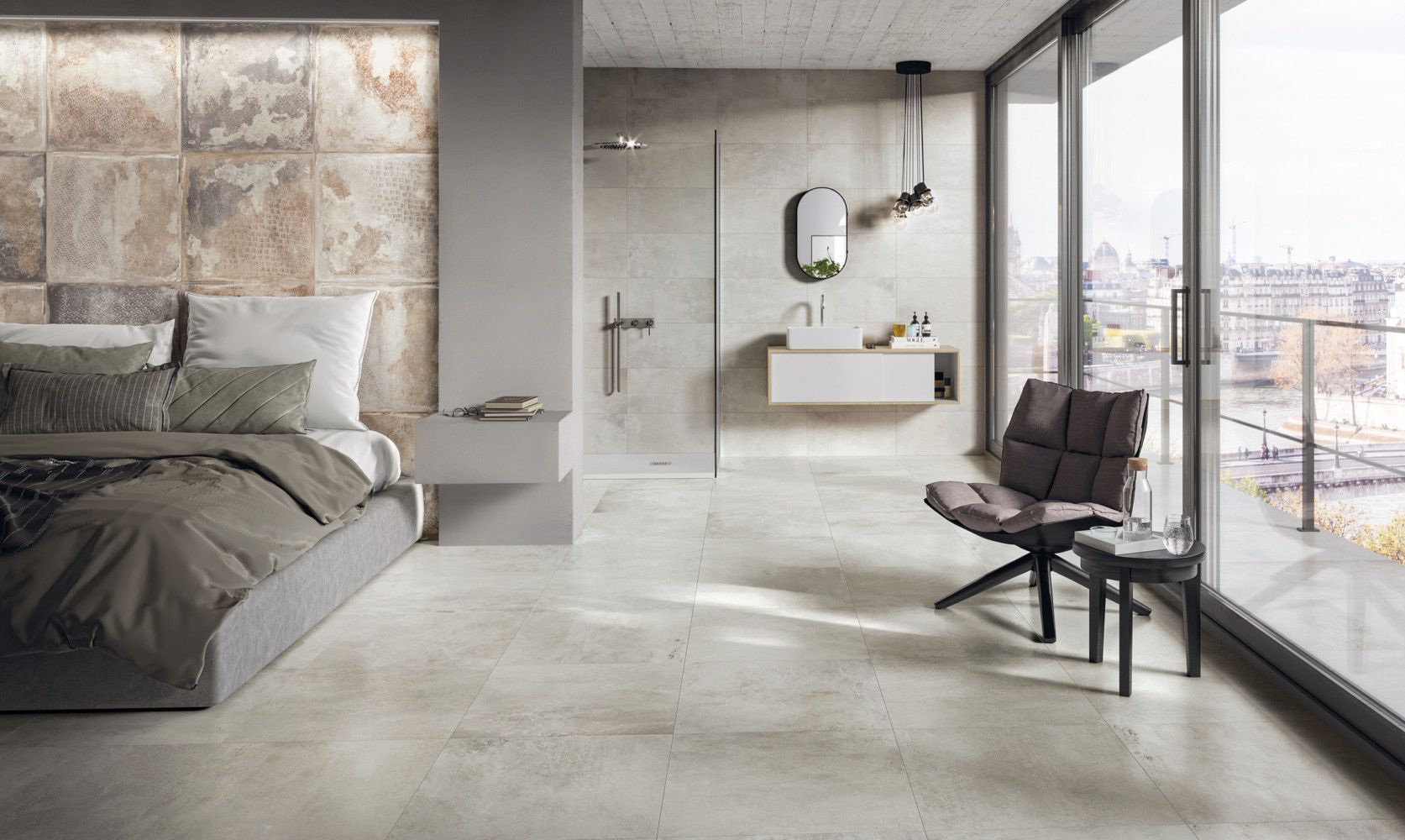 Una camera da letto con un letto, una sedia, un lavandino e grandi finestre.