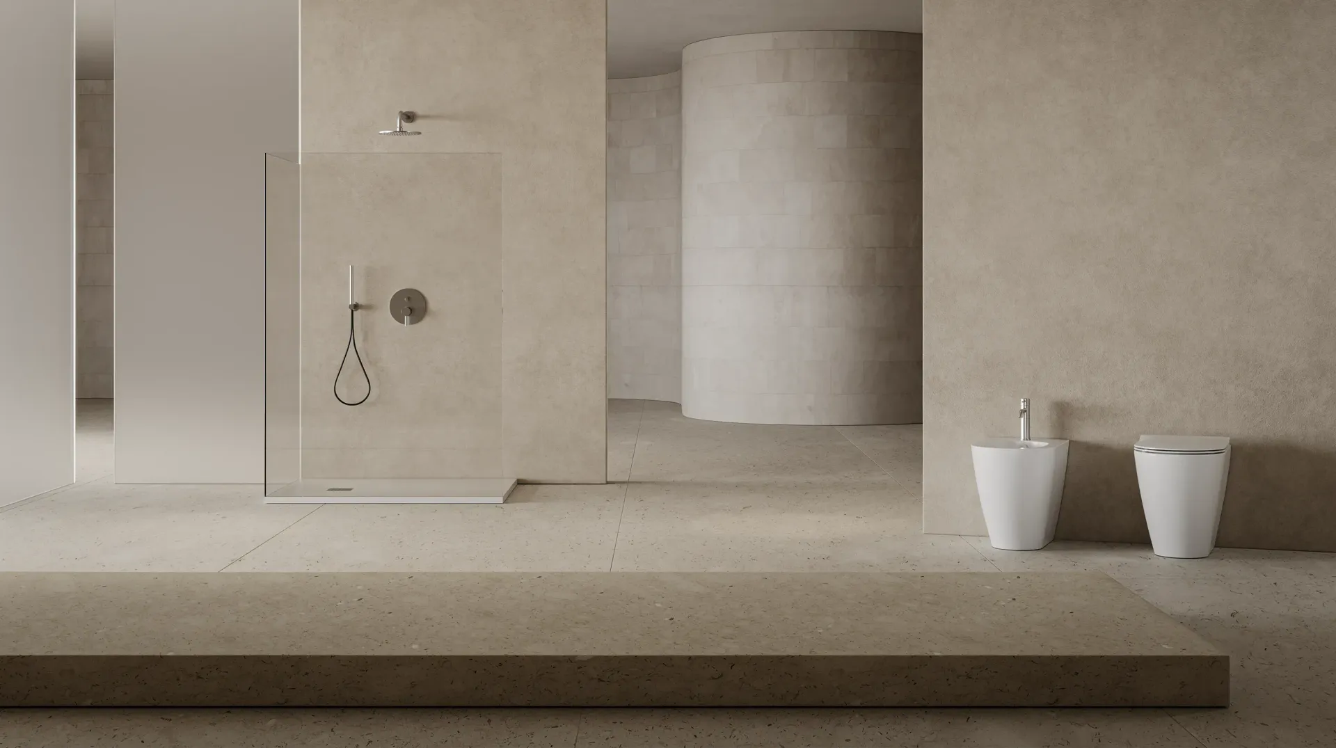 Un bagno con cabina doccia, wc e bidet.