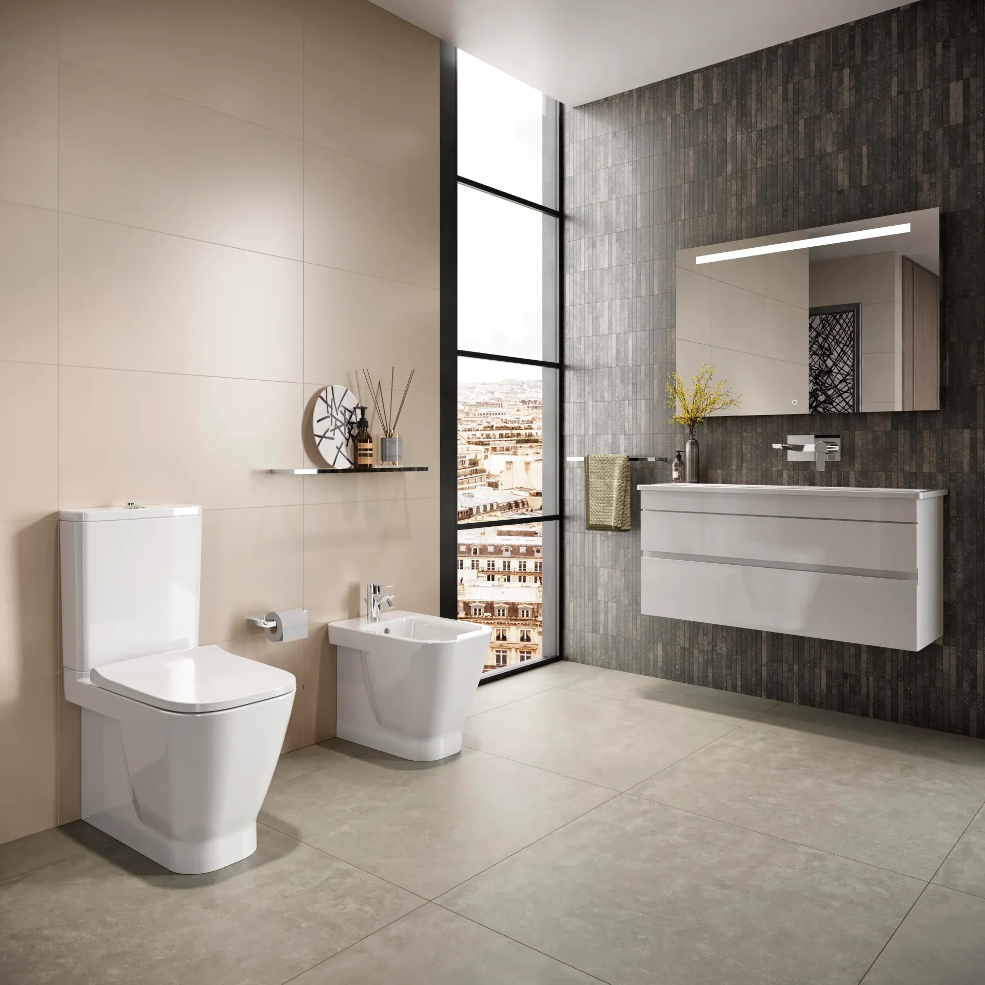 Un bagno con un water un bidet e un lavandino