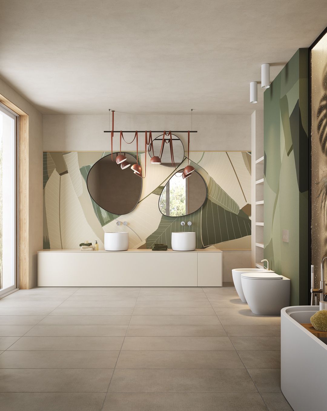 Un bagno con due lavandini, due water e una vasca da bagno.