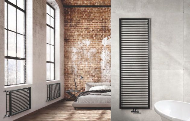 Un bagno con un muro di mattoni, un letto, una vasca e un termosifone.