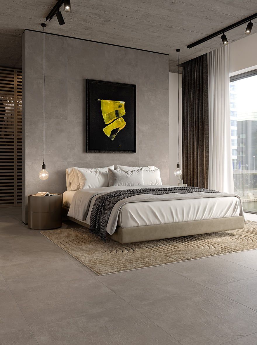 Una camera da letto con un letto grande e un quadro sul muro.