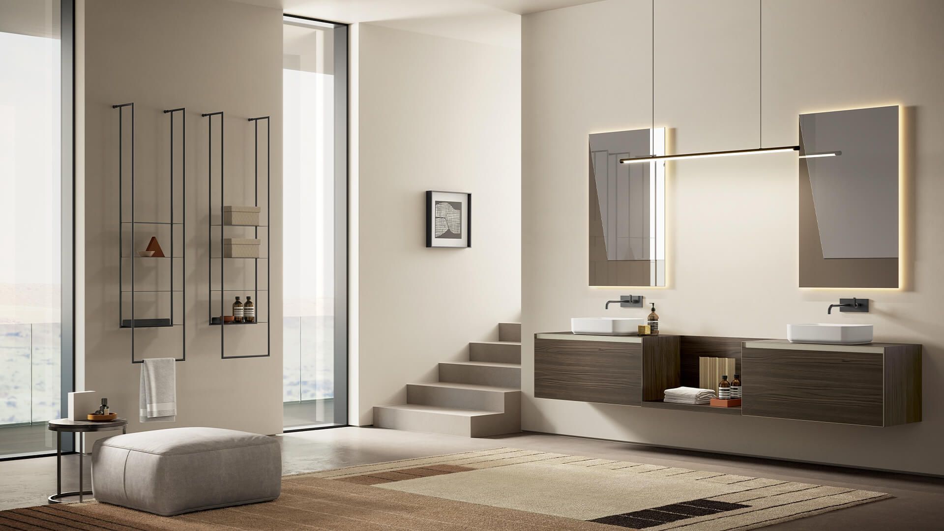 Un bagno con due lavandini e due specchi