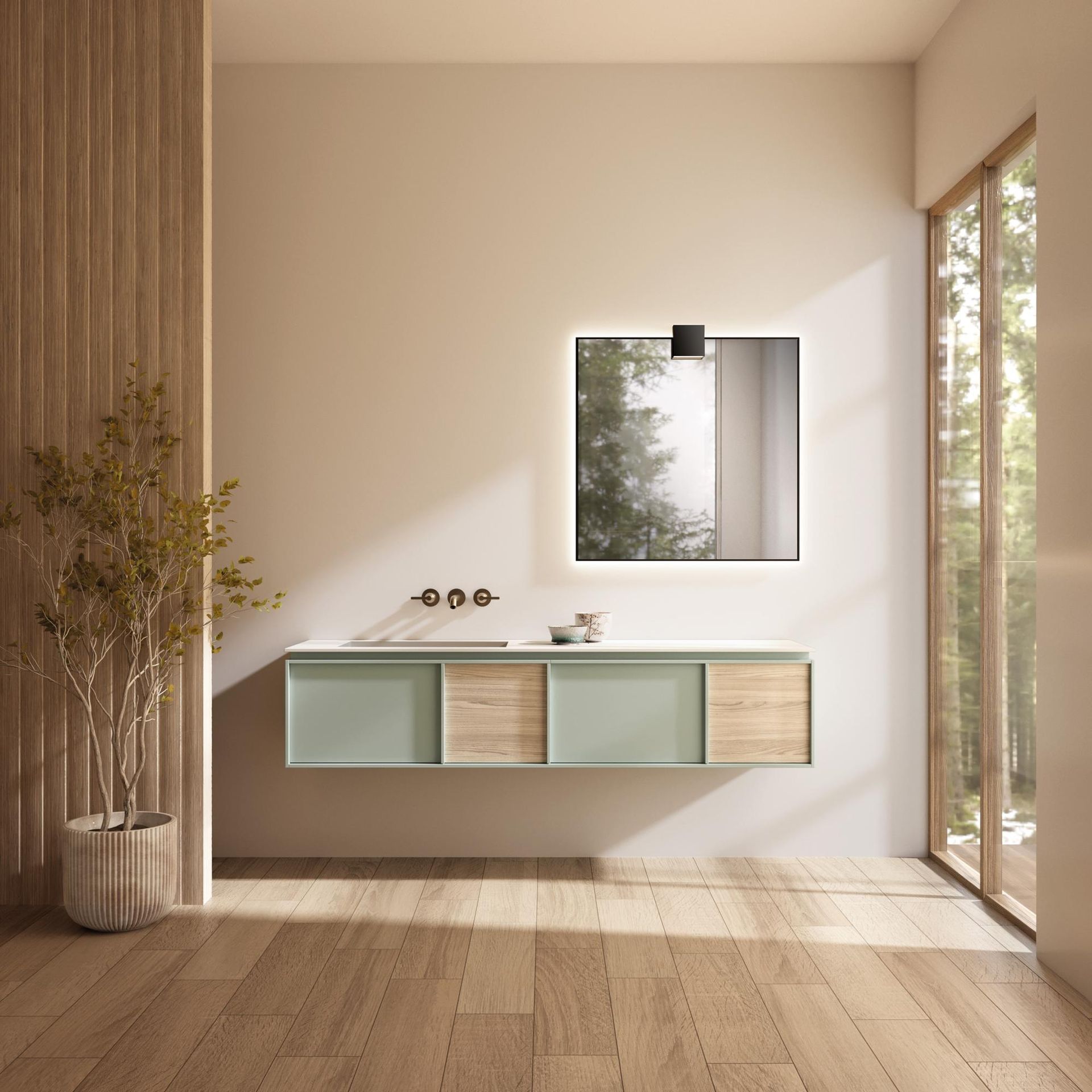 Un bagno con un lavandino e uno specchio sul muro.