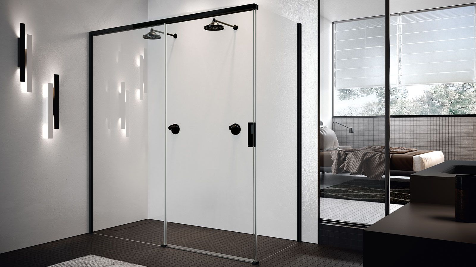 Un bagno con porta doccia scorrevole in vetro e maniglie nere.