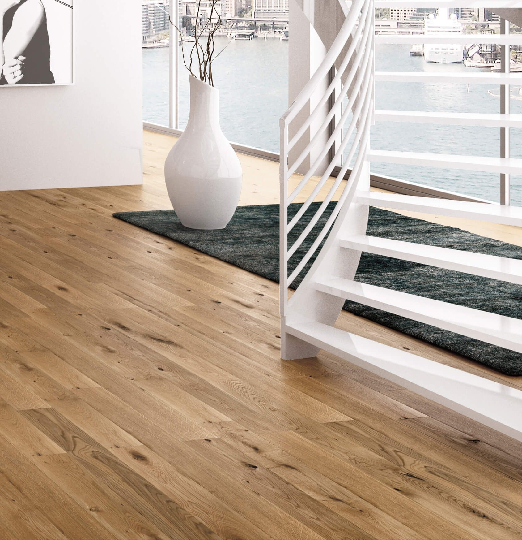 Un soggiorno con pavimento in legno e scale bianche