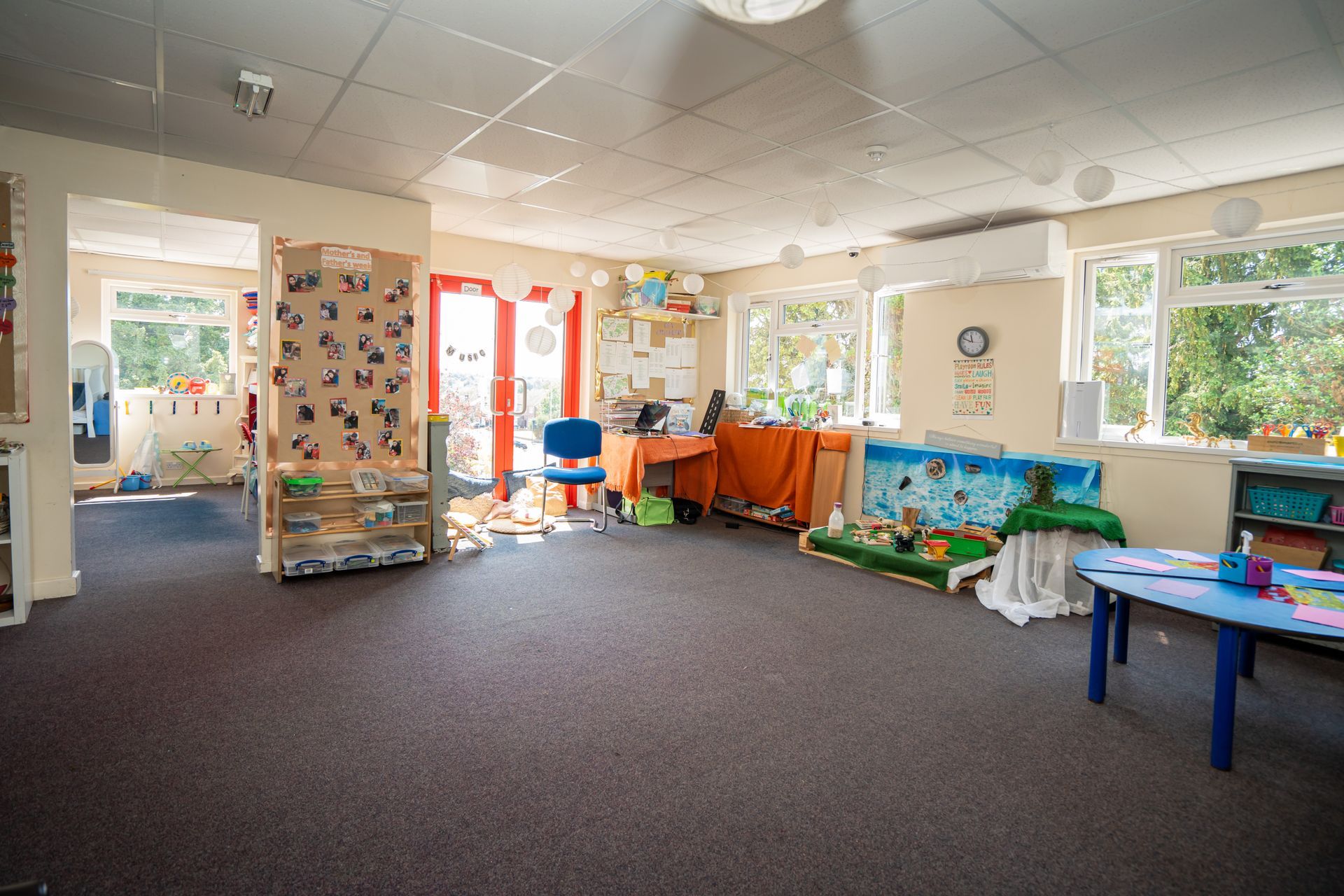 A large empty room with a table and chairs in it. Gingerbread