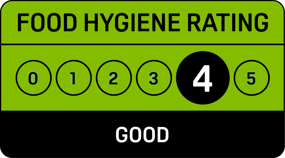 A green and black sign that says food hygiene rating good Gingerbread