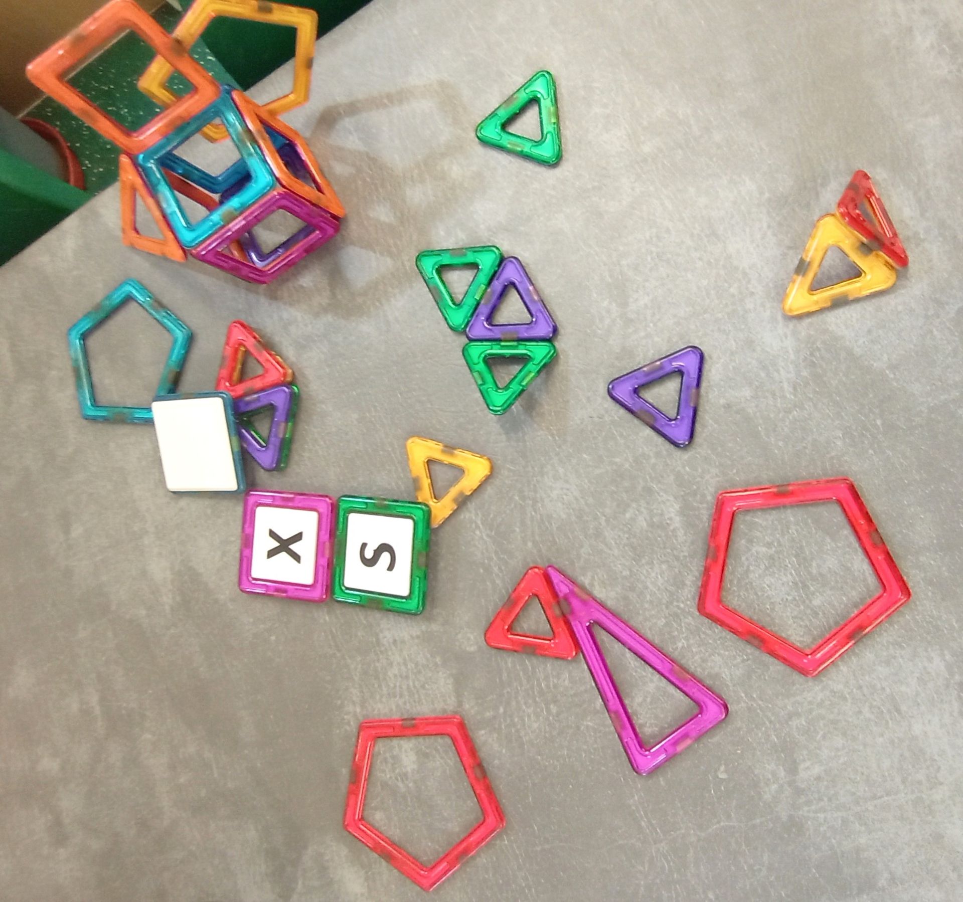 A bunch of magnetic blocks with the letters x and s on them Gingerbread