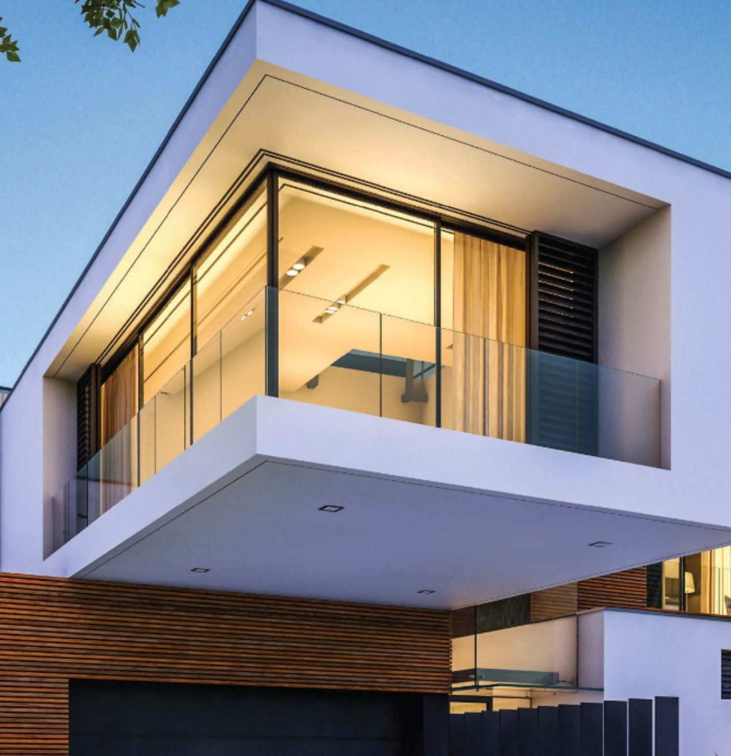 A modern house with a balcony and lots of windows