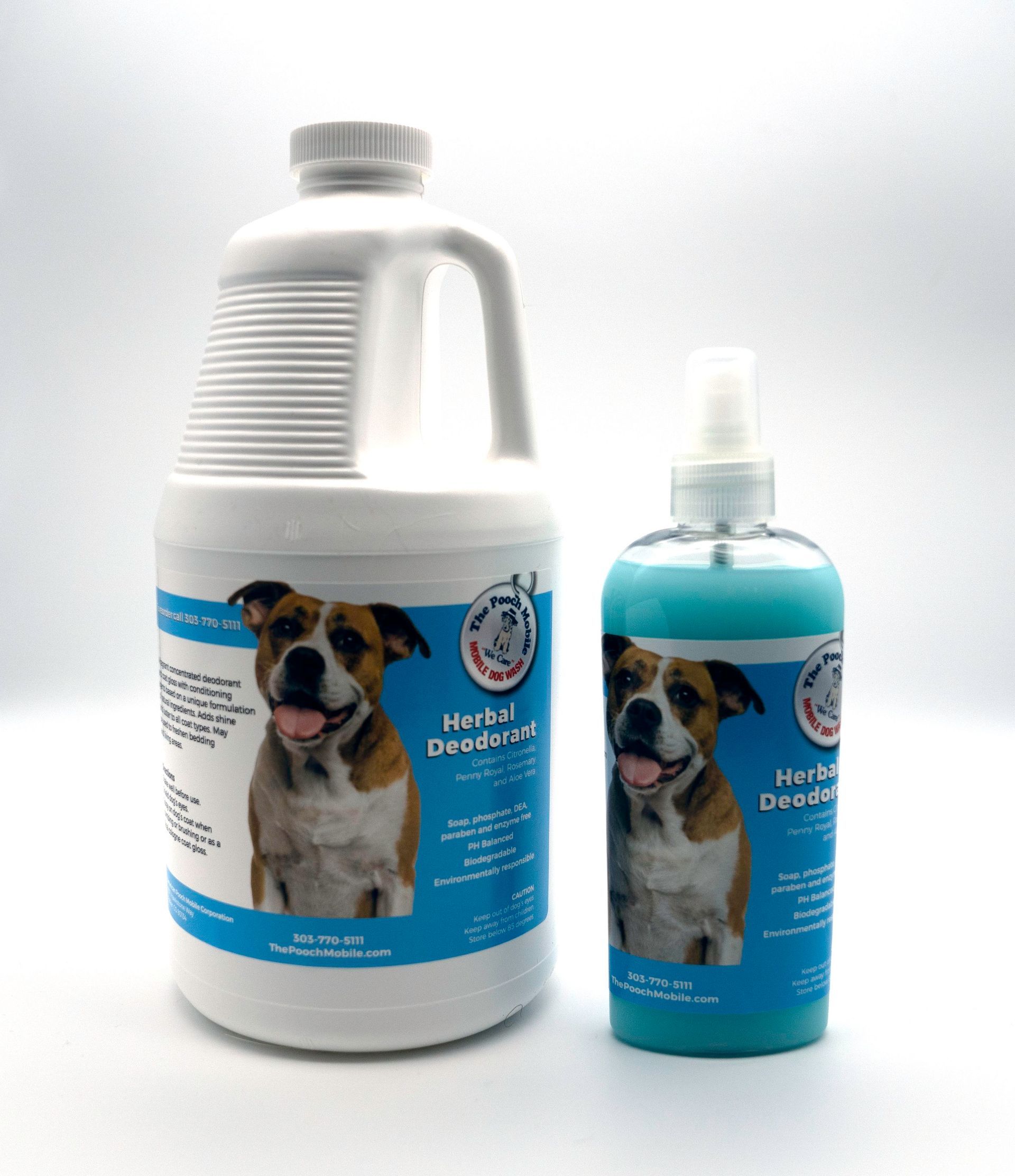 Two bottles of dog shampoo are sitting next to each other on a table.