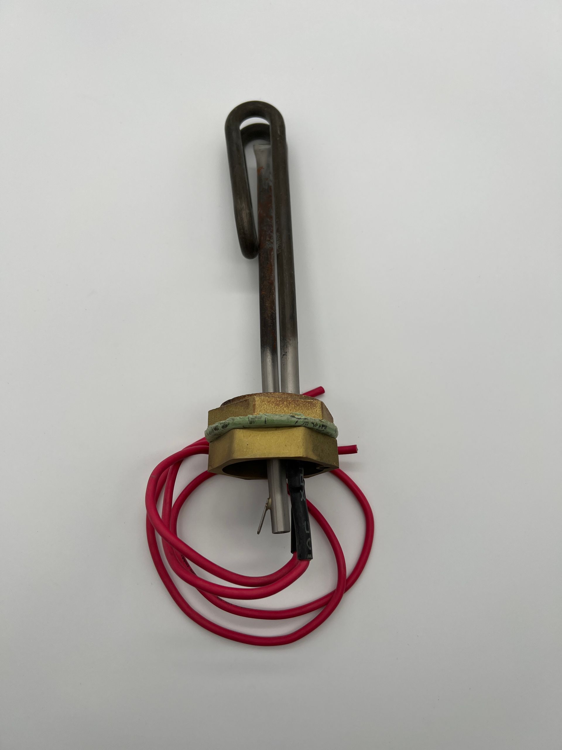A heater with a red wire attached to it