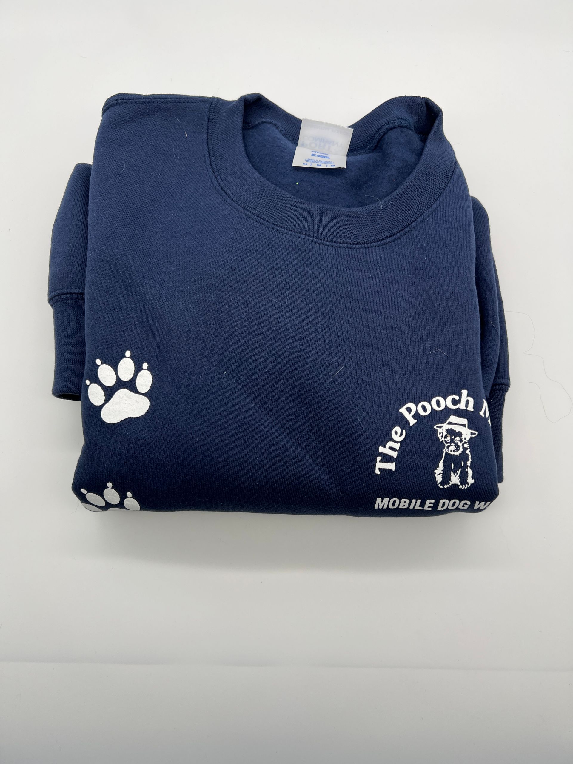 A blue sweatshirt with a paw print and the word pooch on it