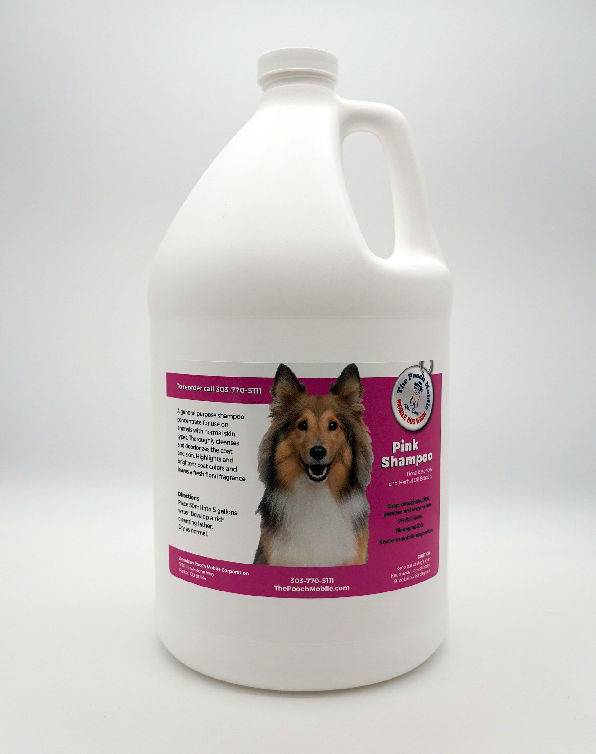 A gallon of dog shampoo with a picture of a collie on the label.
