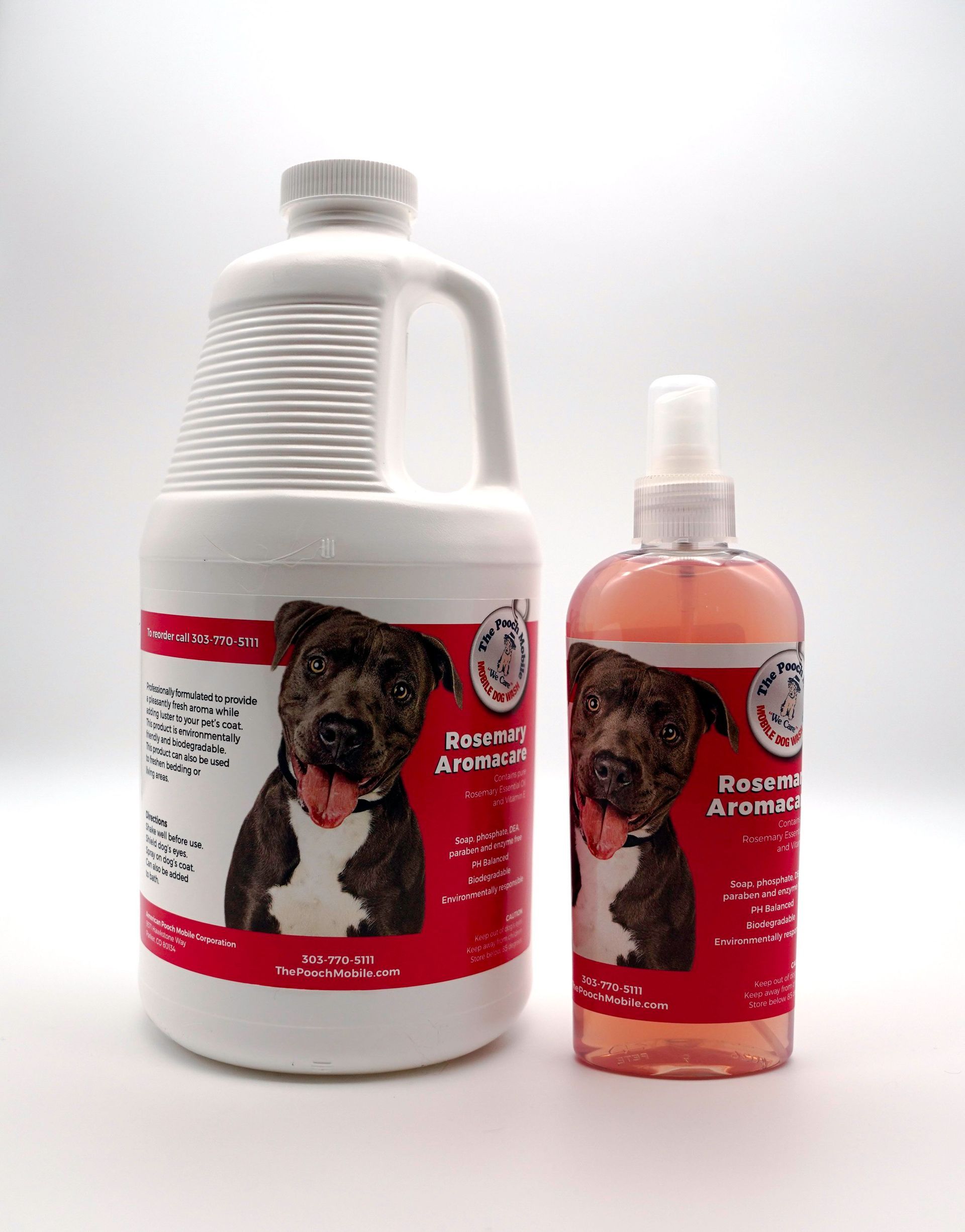 Two bottles of dog shampoo are sitting next to each other on a white surface.