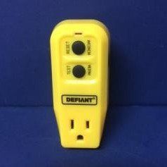 A yellow remote control is sitting on top of a blue table.