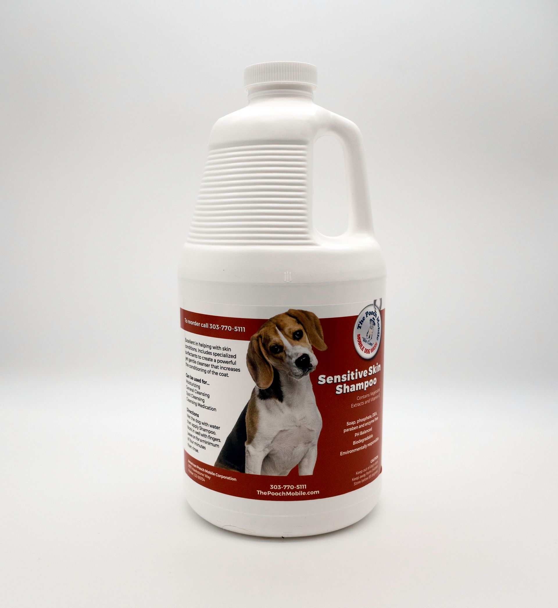 A gallon bottle of dog shampoo with a picture of a beagle on the label.