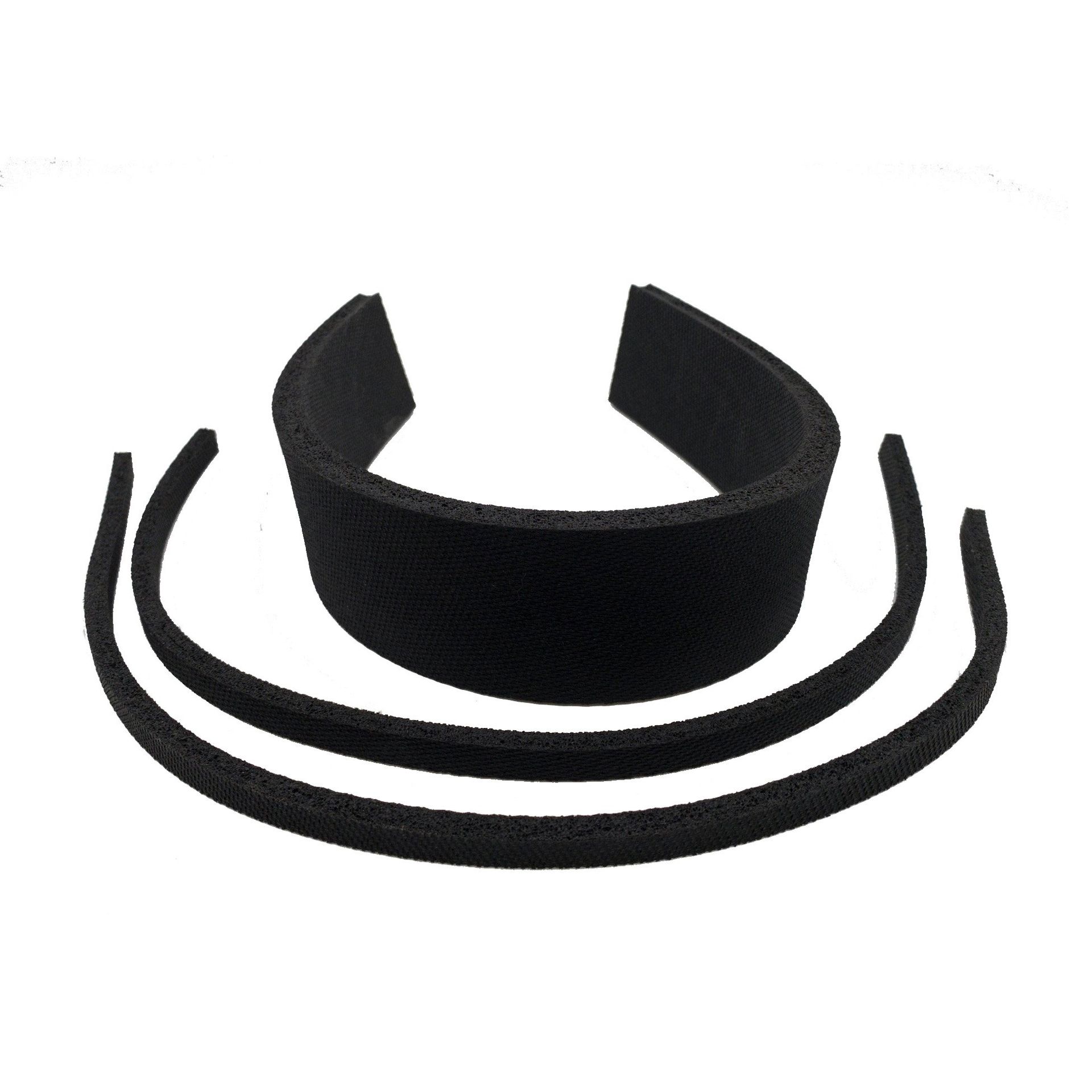 A black headband is sitting on a white surface