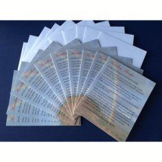 A bunch of cards are stacked on top of each other on a table.