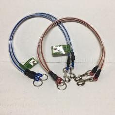 A couple of ropes sitting on top of each other on a table.